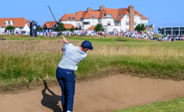 Rory McIlroy, of Northern Ireland, plays from a bunker on the 11th hole during day one of the Genesis Scottish Open 2026 at The Renaissance Club in North Berwick, Scotland, Thursday, July 9, 2026. (Malcolm Mackenzie/PA via AP)