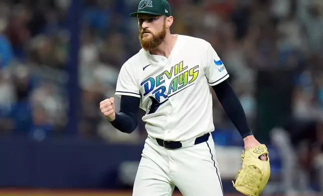 Tampa Bay Rays pitcher Bryan Baker reaacts after closing out the Cleveland Guardians during the ninth inning of a baseball game Saturday, July 25, 2026, in St. Petersburg, Fla. (AP Photo/Chris O'Meara)