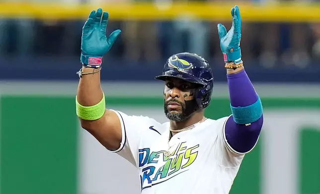Tampa Bay Rays' Yandy Díaz celebrates his double off Cleveland Guardians pitcher Tanner Bibee during the fifth inning of a baseball game Saturday, July 25, 2026, in St. Petersburg, Fla. (AP Photo/Chris O'Meara)