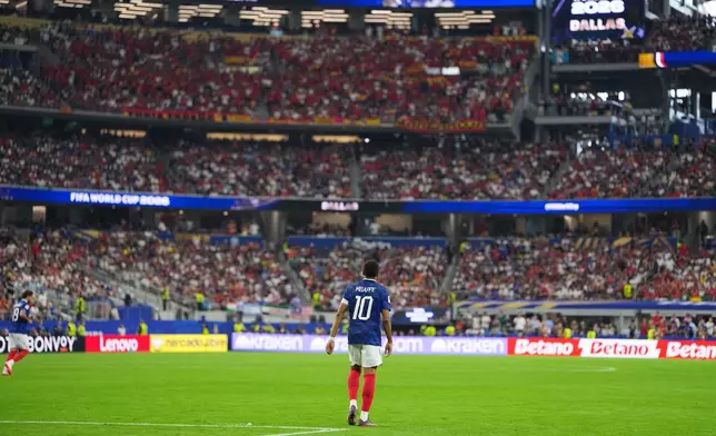 France's Kylian Mbappe walks the field during a World Cup semifinal soccer match against Spain in Arlington, Texas, near Dallas, Tuesday, July 14, 2026. (AP Photo/Julio Cortez)