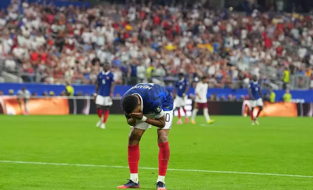 France's Kylian Mbappe reacts during a World Cup semifinal soccer match against Spain in Arlington, Texas, near Dallas, Tuesday, July 14, 2026. (AP Photo/Julio Cortez)
