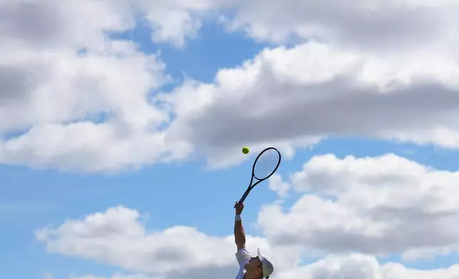 Otto Virtanen of Finland serves during the second round men's singles match against Arthur Fery of Britain at the Wimbledon Tennis Championships in London, Thursday, July 2, 2026.(AP Photo/Kin Cheung)