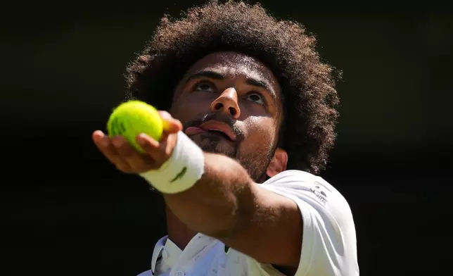 Arthur Fils of France serves the ball during the second round men's singles match against Matteo Berrettini of Italy at the Wimbledon Tennis Championships in London, Thursday, July 2, 2026.(AP Photo/Kirsty Wigglesworth)