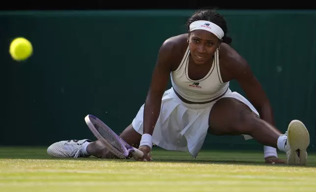Coco Gauff of the United States eyes the ball during a point against Solana Sierra of Argentina in their second round women's singles match at the Wimbledon Tennis Championships in London, Wednesday, July 1, 2026. (AP Photo/Kin Cheung)