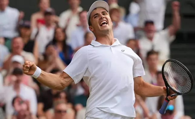Arthur Fery of Britain celebrates winning the fourth set during the men's singles fourth round match against Grigor Dimitrov of Bulgaria at the Wimbledon Tennis Championships in London, Monday, July 6, 2026.(AP Photo/Kirsty Wigglesworth)