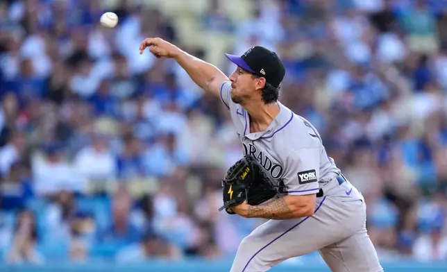 Colorado Rockies starting pitcher Michael Lorenzen throws to the plate during the first inning of a baseball game against the Los Angeles Dodgers, Tuesday, July 7, 2026, in Los Angeles. (AP Photo/Mark J. Terrill)