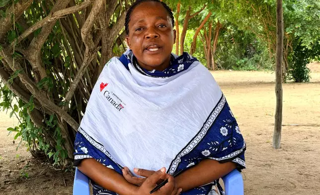Beatrice Mwanyiro, chair of the Samito Women Group, is interviewed outside the group's unfinished restaurant and mangrove restoration center in Sabaki, Malindi, Kenya, on June 15, 2026. (AP Photo/Allan Olingo)