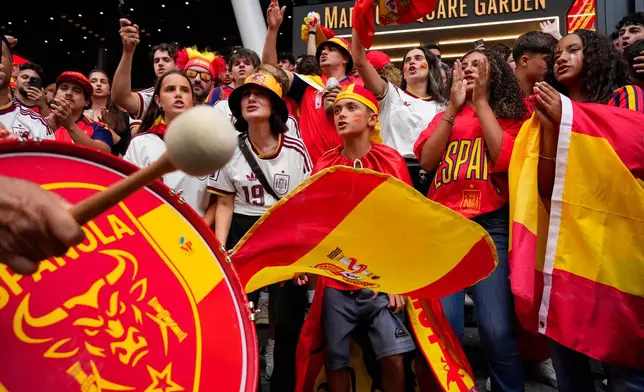 Spain fans gather for a rally on the eve of the World Cup final soccer match in New York's Times Square, Saturday, July 18, 2026 (AP Photo/Yuki Iwamura)