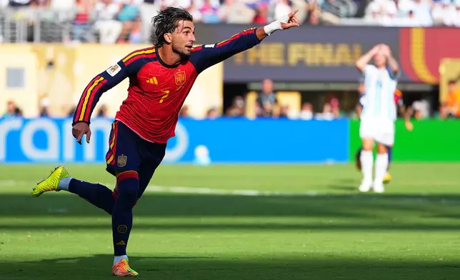 Spain's Ferran Torres (7) celebrates scoring their first goal during the World Cup final soccer match between Spain and Argentina in East Rutherford, N.J., near New York, Sunday, July 19, 2026. (AP Photo/Julio Cortez)