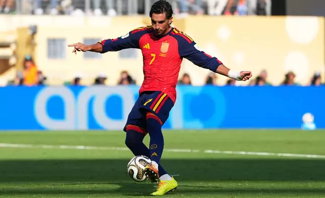 Spain's Ferran Torres (7) scores their first goal during the World Cup final soccer match between Spain and Argentina in East Rutherford, N.J., near New York, Sunday, July 19, 2026. (AP Photo/Julio Cortez)