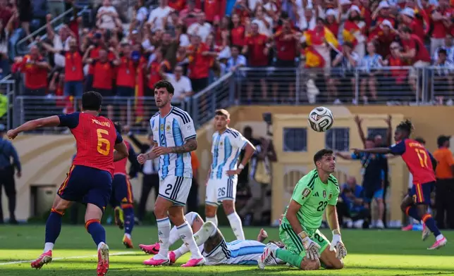 Argentina goalkeeper Emiliano Martinez (23), Marcos Senesi (2) and Nahuel Molina (26) react after Spain's Ferran Torres (7) scores their first goal during the World Cup final soccer match between Spain and Argentina in East Rutherford, N.J., near New York, Sunday, July 19, 2026. (AP Photo/Abbie Parr)