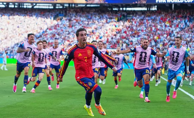 Spain's Ferran Torres (7) celebrates scoring their first goal during the World Cup final soccer match between Spain and Argentina in East Rutherford, N.J., near New York, Sunday, July 19, 2026. (AP Photo/Julio Cortez)