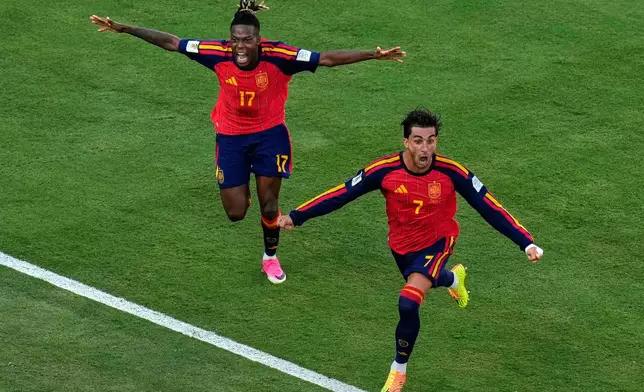 Spain's Ferran Torres (7) celebrates after scoring the opening goal of his team during the World Cup final soccer match between Spain and Argentina in East Rutherford, N.J., near New York, Sunday, July 19, 2026. (AP Photo/Seth Wenig)