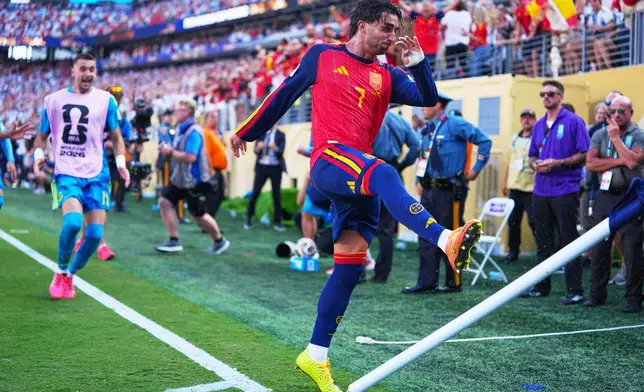 Spain's Ferran Torres (7) celebrates scoring their first goal during the World Cup final soccer match between Spain and Argentina in East Rutherford, N.J., near New York, Sunday, July 19, 2026. (AP Photo/Julio Cortez)