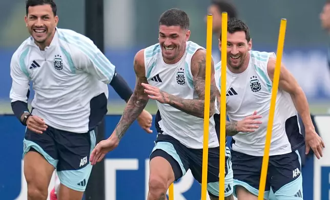 Argentina's Lionel Messi, Rodrigo Javier De Paul and Leandro Paredes, from right, during a training session on the eve of the World Cup final soccer match in Morristown, N.J., Saturday, July 18, 2026. (AP Photo/Ashley Landis)