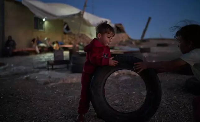 Palestinian children play outside their houses in a community near the West Bank village of Susya, in the Masafer Yatta region, Wednesday, June 17, 2026.(AP Photo/Leo Correa)