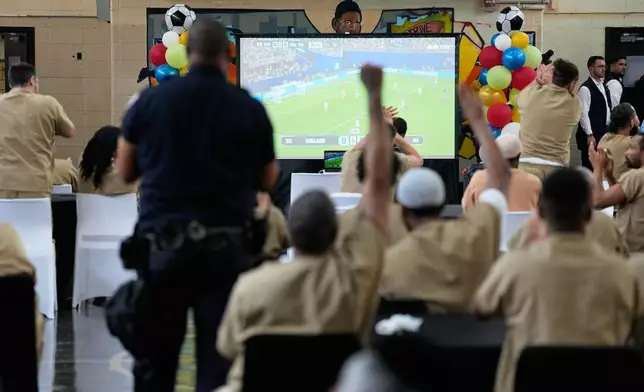 Rikers Island inmates react as New York City Mayor Zohran Mamdani, not pictured, leaves the jail complex during a World Cup semifinal soccer match watch party for the game between England and Argentina, in New York, Wednesday, July 15, 2026. (AP Photo/Seth Wenig)