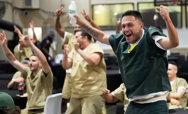 Rikers Island inmate Victor Caldas, an Argentina fan, reacts during the World Cup semifinal soccer match between England and Argentina, at the jail complex in New York, Wednesday, July 15, 2026. (AP Photo/Seth Wenig)