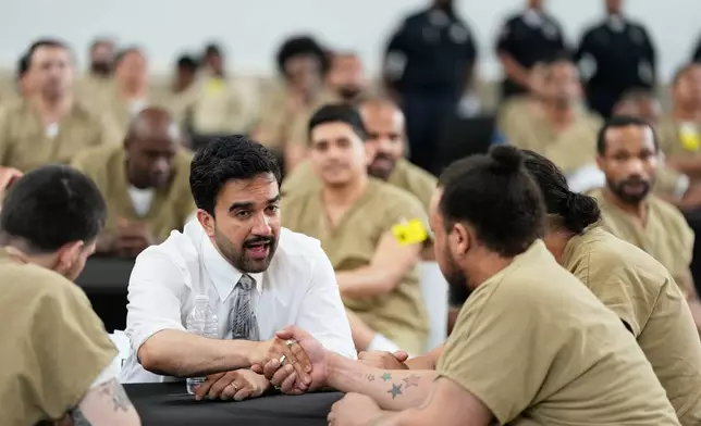 New York City Mayor Zohran Mamdani speaks with Rikers Island inmates as they watch the World Cup semifinal soccer match between England and Argentina, at the jail complex in New York, Wednesday, July 15, 2026. (AP Photo/Seth Wenig)