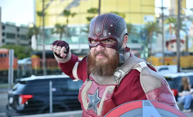 Daniel Huerta, from Simi Valley, Calif., poses for a photo dressed as "Red Guardian" during preview night for Comic-Con International on Wednesday, July 22, 2026, in San Diego. (Photo by Richard Shotwell/Invision/AP)