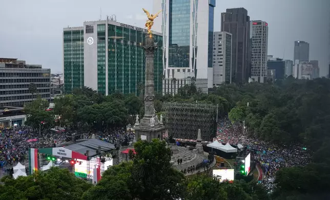 Soccer fans gather for a watch party for the World Cup soccer match between Mexico and Ecuador, at the base of the Angel of Independence monument in Mexico City, Tuesday, June 30, 2026. (AP Photo/Marco Ugarte)