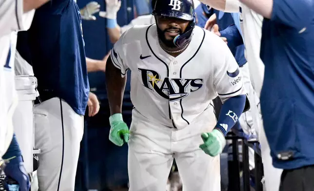 Tampa Bay Rays' Junior Caminero celebrates his two-run home run during the seventh inning of a baseball game against the Seattle Mariners Friday, July 10, 2026, in St. Petersburg, Fla. (AP Photo/Jason Behnken)
