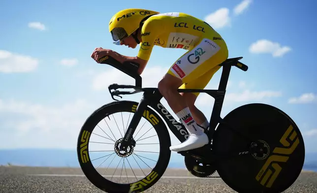 Slovenia's Tadej Pogacar, wearing the overall leader's yellow jersey, rides during the sixteenth stage of the Tour de France cycling race, an indivdual time-trial with start in Evian-Les-Bains and finish in Thonon-les-Bains, France, Tuesday, July 21, 2026. (AP Photo/Thibault Camus)
