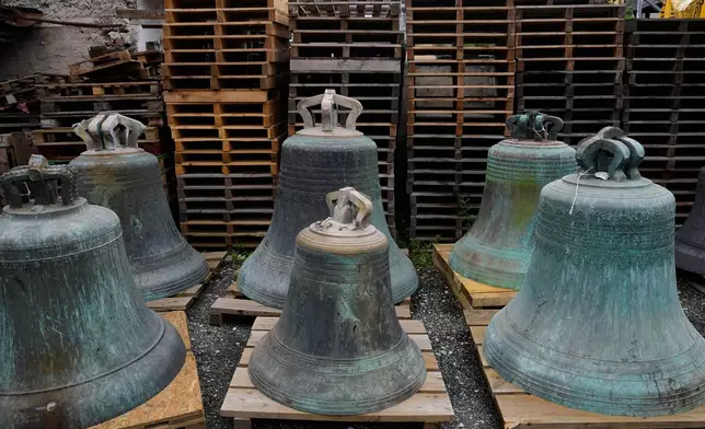 Old bells stand in the backyard of the 400-year-old family-owned bell foundry Grassmayr in Innsbruck, Austria, Friday, July 17, 2026. (AP Photo/Matthias Schrader)