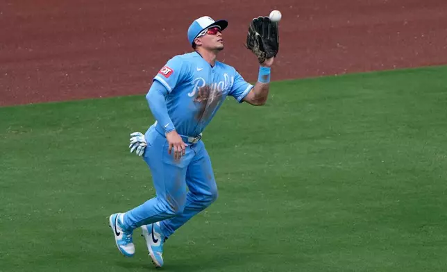 Kansas City Royals left fielder Isaac Collins catches a fly ball for the out on Philadelphia Phillies' Garrett Stubbs during the fifth inning of a baseball game Sunday, July 5, 2026, in Kansas City, Mo. (AP Photo/Charlie Riedel)