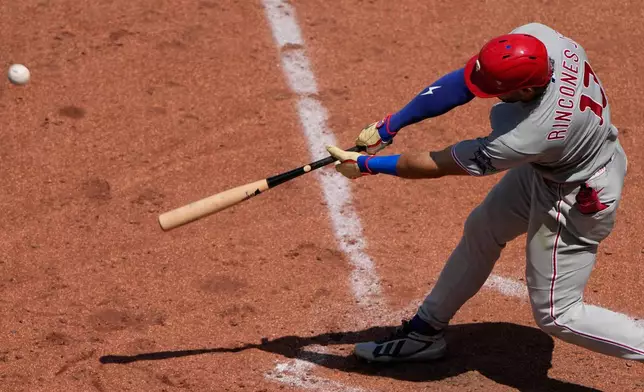 Philadelphia Phillies' Gabriel Rincones Jr. hits a sacrifice fly to score a run during the fifth inning of a baseball game against the Kansas City Royals, Sunday, July 5, 2026, in Kansas City, Mo. (AP Photo/Charlie Riedel)