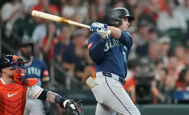 Seattle Mariners' Brendan Donovan hits an RBI single against Houston Astros starting pitcher Hayden Wesneski during the second inning of a baseball game, Saturday, August 15, 2026, in Houston. (AP Photo/Karen Warren)