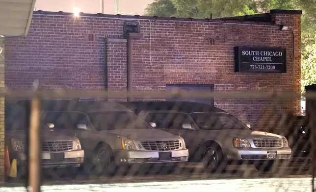 A row of hearses sit parked outside the South Chicago Chapel while Chicago police investigate after authorities discovered dozens of decomposing bodies in the funeral home's basement on Thursday, Aug. 6, 2026. (Tyler Pasciak LaRiviere/Chicago Sun-Times via AP)