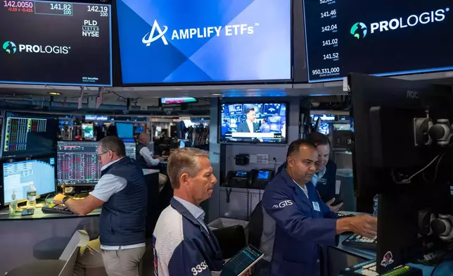 Specialists Dilip Patel, right, and Trader Robert Charmak, center, work on the floor of the New York Stock Exchange, Thursday, Aug. 27, 2026, in New York. (AP Photo/Yuki Iwamura)