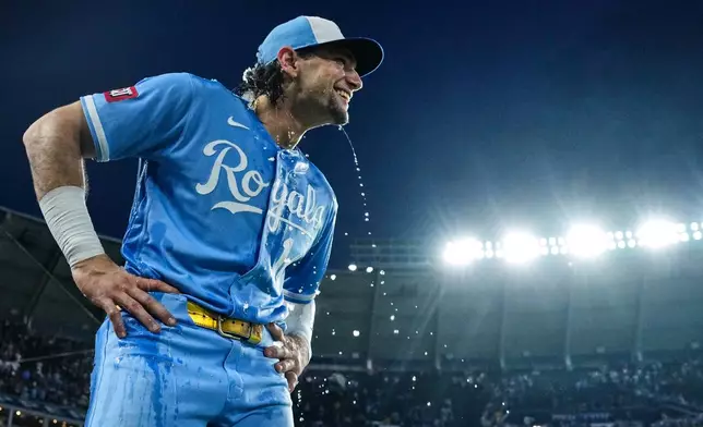 Water drips from Kansas City Royals' Jac Caglianone after he was doused by teammates following their baseball game against the Chicago Cubs, Saturday, Aug. 8, 2026, in Kansas City, Mo. (AP Photo/Charlie Riedel)