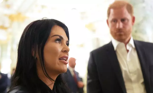 Britain's Prince Harry, the Duke of Sussex, listens as Sarah Verardo, CEO of The Independence Fund, speaks to The Associated Press after a roundtable about support for veterans, Wednesday, Aug. 19, 2026, in Washington. (AP Photo/Alex Brandon) CORRECTIONS: Corrects name to Verardo, instead of Verado