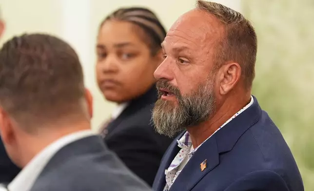 U.S. Army and U.S. Navy veteran Jason Wheeler speaks during a roundtable with Britain's Prince Harry, the Duke of Sussex, Wednesday, Aug. 19, 2026, in Washington. (AP Photo/Alex Brandon)