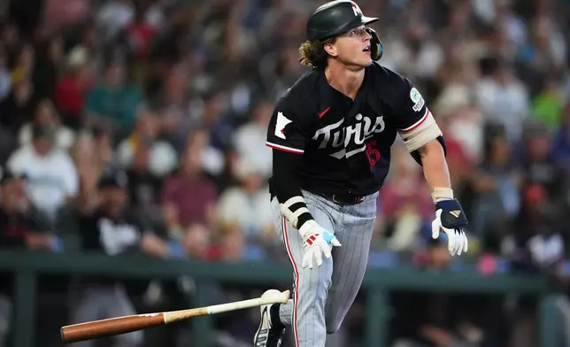 Minnesota Twins' Luke Keaschall follows through on a solo home run against the Seattle Mariners during the ninth inningof a baseball game, Sunday, Aug. 2, 2026, in Seattle. (AP Photo/Lindsey Wasson)
