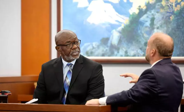 Former Las Vegas Metro Police officer Charlie Mangrum listens to Chief Deputy District Attorney Marc DiGiacomo during the Duane Davis trial, related to the 1996 killing of rapper Tupac Shakur, in Clark County District Court at the Regional Justice Center in Las Vegas on Thursday, Aug. 27, 2026. (Steve Marcus/Las Vegas Sun via AP, Pool)