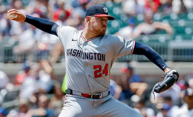 Washington Nationals pitcher Cade Cavalli delivers to an Atlanta Braves batter during the first inning of a baseball game, Sunday, Aug. 2, 2026, in Atlanta. (AP Photo/Erik S. Lesser)