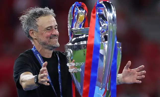FILE - PSG's head coach Luis Enrique celebrates after the Champions League final soccer match between Paris Saint-Germain and Arsenal in Budapest, Hungary, Saturday, May 30, 2026. AP Photo/Armin Durgut, File)