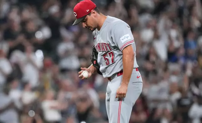 Cincinnati Reds relief pitcher Julian Garcia looks down after Chicago White Sox's Chase Meidroth hit a two-run home run during the sixth inning of a baseball game in Chicago, Wednesday, Aug. 12, 2026. (AP Photo/Nam Y. Huh)