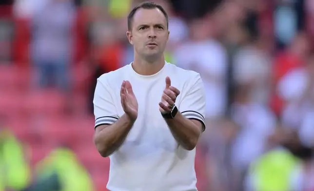 Birmingham City manager Chris Davies applauds the fans after the final whistle of the Championship soccer match between Sheffield United and Birmingham City in Sheffield, England, Saturday Aug. 15, 2026. (Gary Oakley/PA via AP)