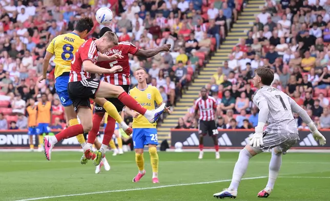 Birmingham City's Paik Seung-Ho, left, heads the ball during the Championship soccer match between Sheffield United and Birmingham City in Sheffield, England, Saturday Aug. 15, 2026. (Gary Oakley/PA via AP)