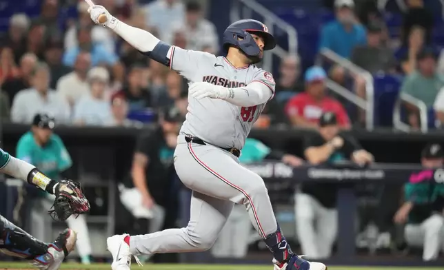 Washington Nationals' Abimelec Ortiz strikes out swinging with the bases loaded during the fifth inning of a baseball game against the Miami Marlins, Sunday, Aug. 23, 2026, in Miami. (AP Photo/Lynne Sladky)