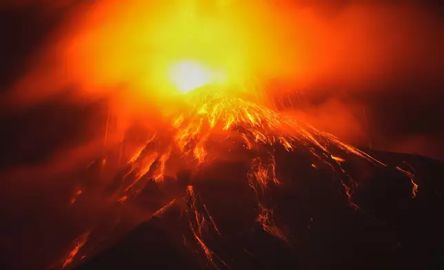 Lava flows out of the crater of the Fuego Volcano, as seen from San Juan Alotenango, Guatemala, Tuesday, Aug. 4, 2026. (AP Photo/Moises Castillo)