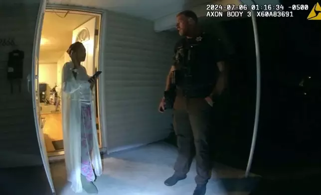 FILE - In this image from body camera video released by Illinois State Police, Sonya Massey, left, talks with Sangamon County Sheriff's Deputy Sean Grayson outside her home in Springfield, Ill., July 6, 2024. (Illinois State Police via AP, File)