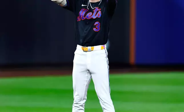 New York Mets' Carson Benge reacts after hitting an RBI double against the Houston Astros during the fourth inning of a baseball game, Friday, Aug. 28, 2026, in New York. (AP Photo/Noah K. Murray)
