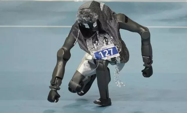 A humanoid robot competes in the breakdance during the World Humanoid Robot Games in Beijing, Tuesday, Aug. 25, 2026. (AP Photo/Achmad Ibrahim)