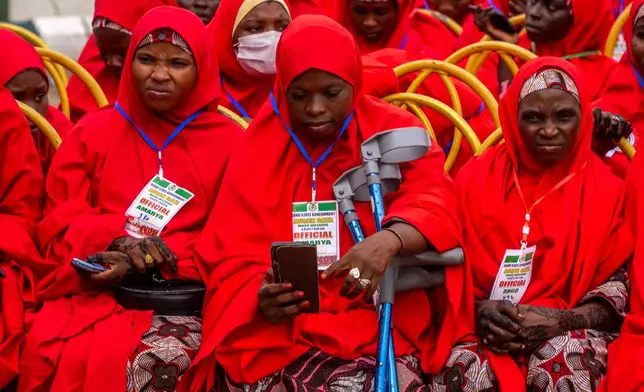 Nigerian brides attend a mass wedding ceremony in Kano, Nigeria, Saturday, Aug. 8, 2026. (AP Photo/Sani Maikatanga)