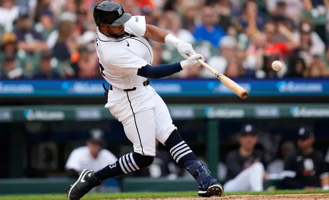 Detroit Tigers' Corey Julks hits a double against the Chicago White Sox during the fifth inning of a baseball game Saturday, Aug. 15, 2026, in Detroit. (AP Photo/Paul Sancya)